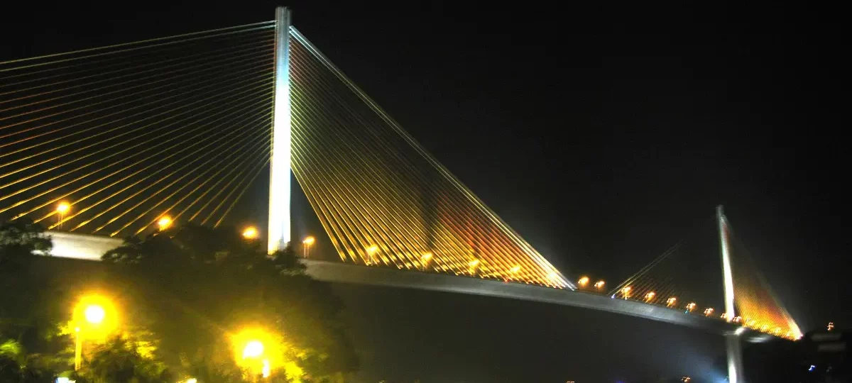 Bai Chay Bridge lit up at night over the Cua Luc strait, Ha Long City