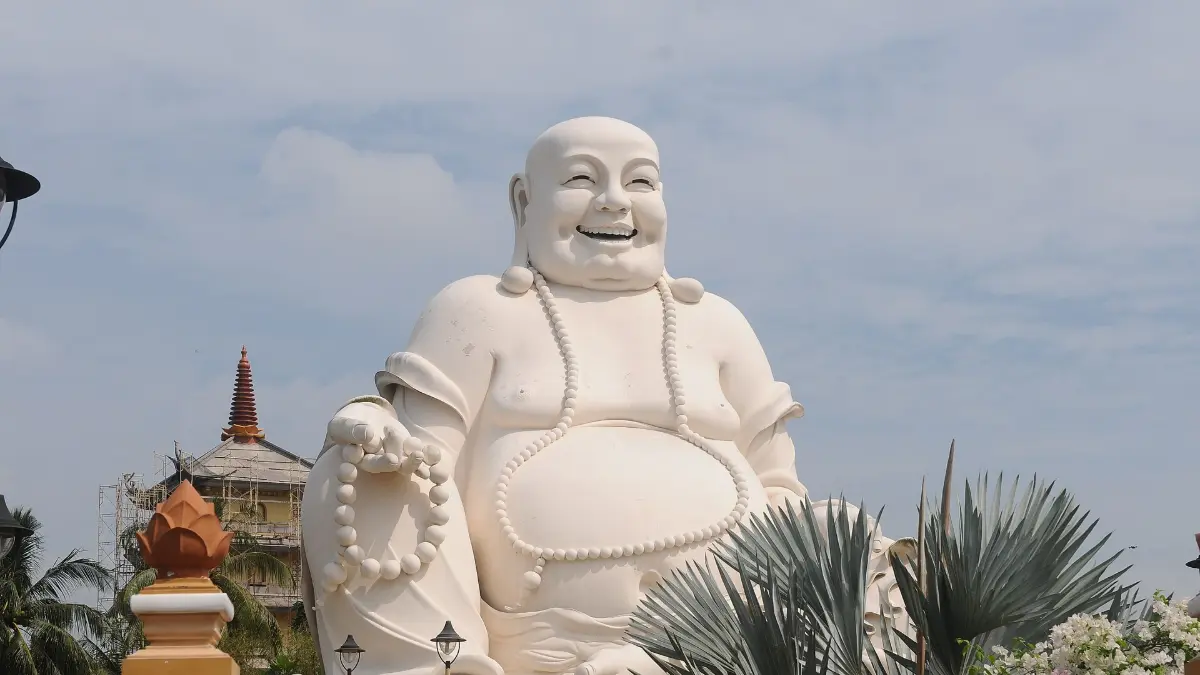 Buddha Statue, Vinh Trang Pagoda Large white Buddha statue in the grounds of Vinh Trang Pagoda, My Tho