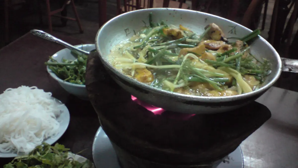 Cha Ca – Hanoi Old Quarter Street Food Cha ca turmeric fish with dill sizzling in a pan, a classic Hanoi Old Quarter dish