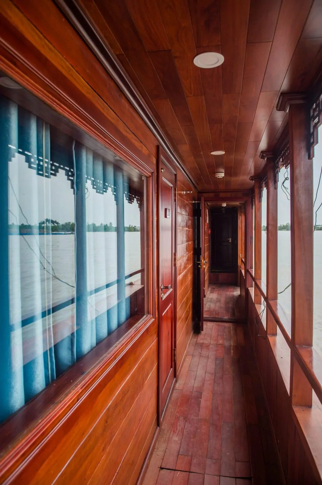 Wooden corridor with panoramic windows on the Dragon Eyes
