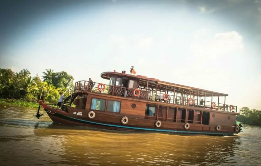 Dragon Eyes, a private two-cabin wooden river cruiser, on the Mekong