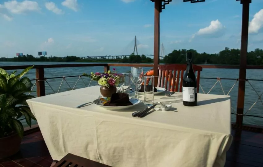 Private dining table with river view on the Dragon Eyes