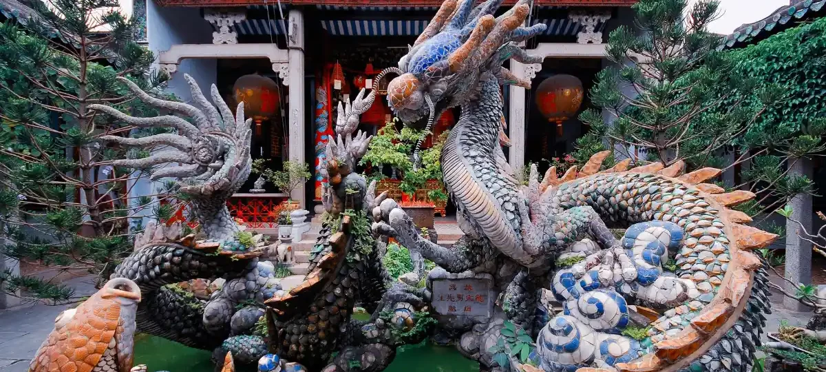 Colourful ceramic dragon fountain in the courtyard of the Cantonese Assembly Hall, Hoi An