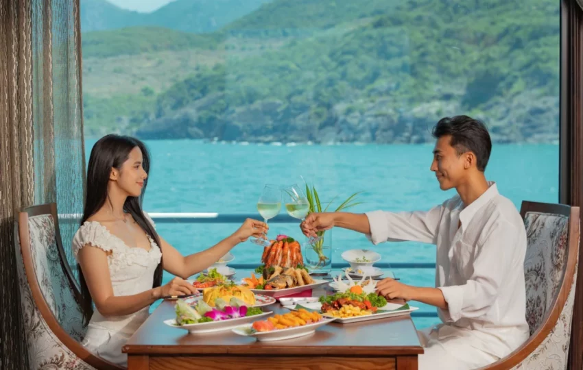 Guests toasting over a seafood platter at lunch on Emperor Cruises Legend