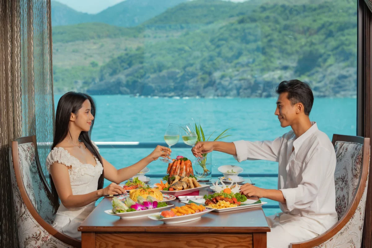 Guests toasting over a seafood platter at lunch on Emperor Cruises Legend