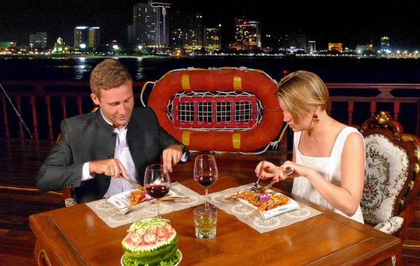 Couple enjoying the five-course seafood dinner on the Emperor Cruises sunset cruise