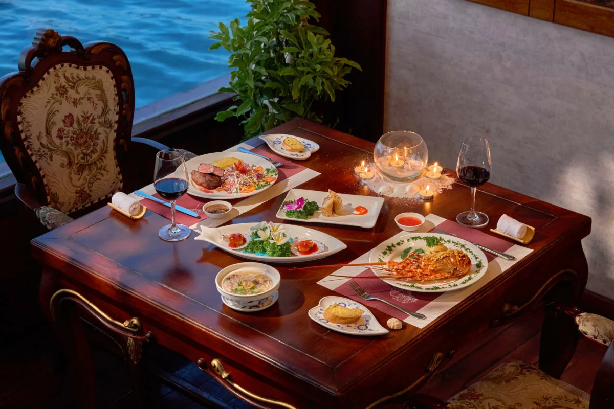 Seafood set lunch with a glass of wine served on Emperor Cruises Origin