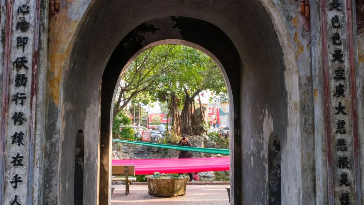 First courtyard seen through Van Mieu Gate View through the Van Mieu Gate arch into the first courtyard of the Temple of Literature