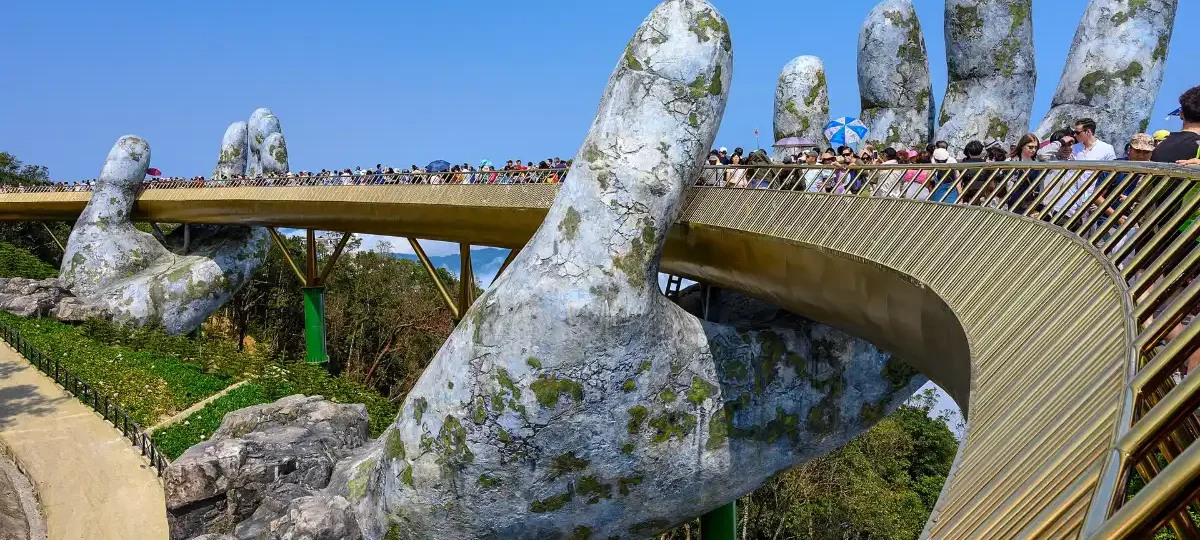 The Golden Bridge held by giant stone hands at Ba Na Hills, Da Nang
