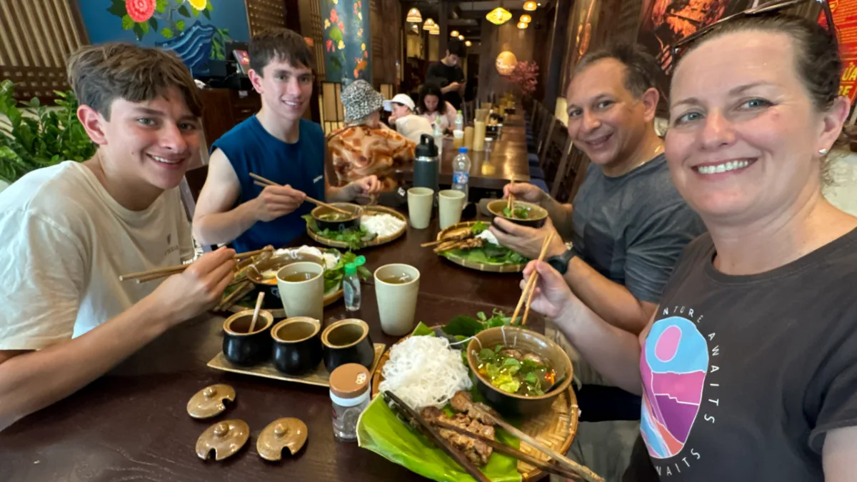 Guests eating on the Saigon foodie tour
