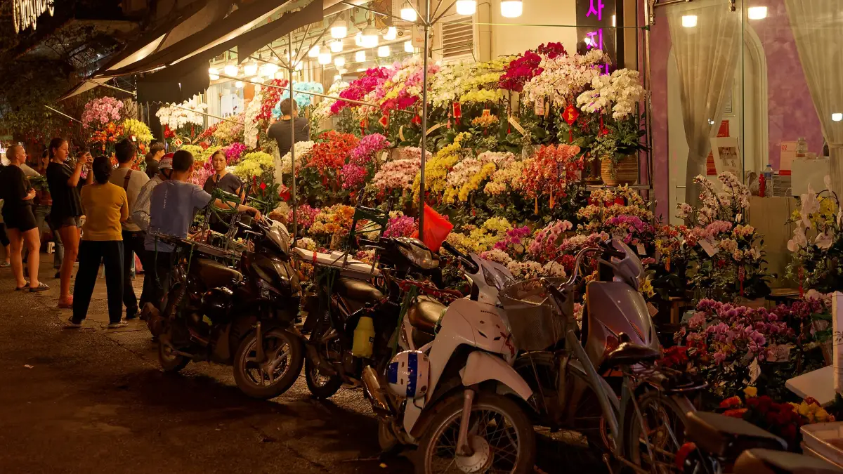 Old Quarter Flower Market in the Evening, Hanoi Flower stalls lit up in the evening at a market in the Hanoi Old Quarter