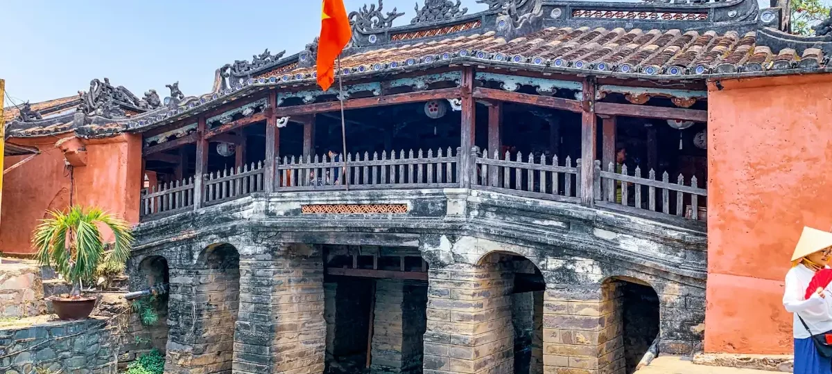 The restored Japanese Covered Bridge in Hoi An Ancient Town under a blue sky, Hoi An’s most iconic landmark