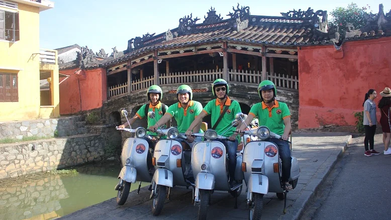 Vespa group at the Japanese Covered Bridge in Hoi An Old Town