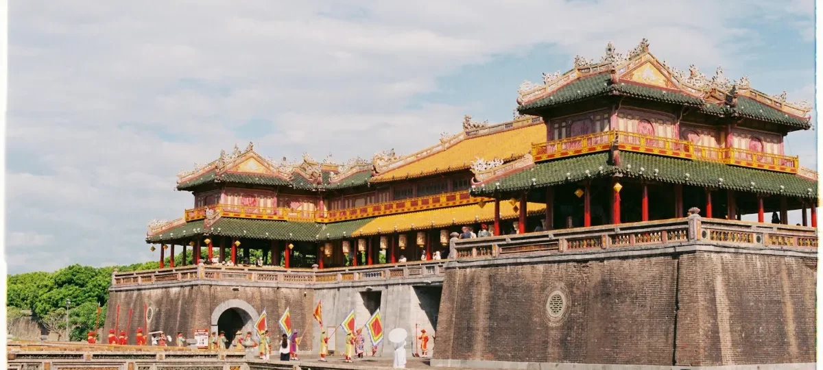 Ngo Mon Gate, the main entrance to the Imperial City in Hue, with its golden roofs under a blue sky