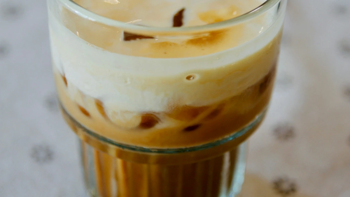 Hanoi Egg Coffee – Iced Egg Coffee Glass of iced Vietnamese egg coffee with layers of coffee, ice and creamy egg foam