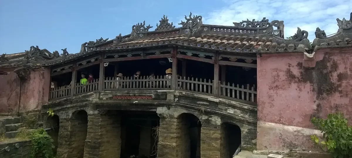The pink Japanese Covered Bridge (Chua Cau) in Hoi An Ancient Town