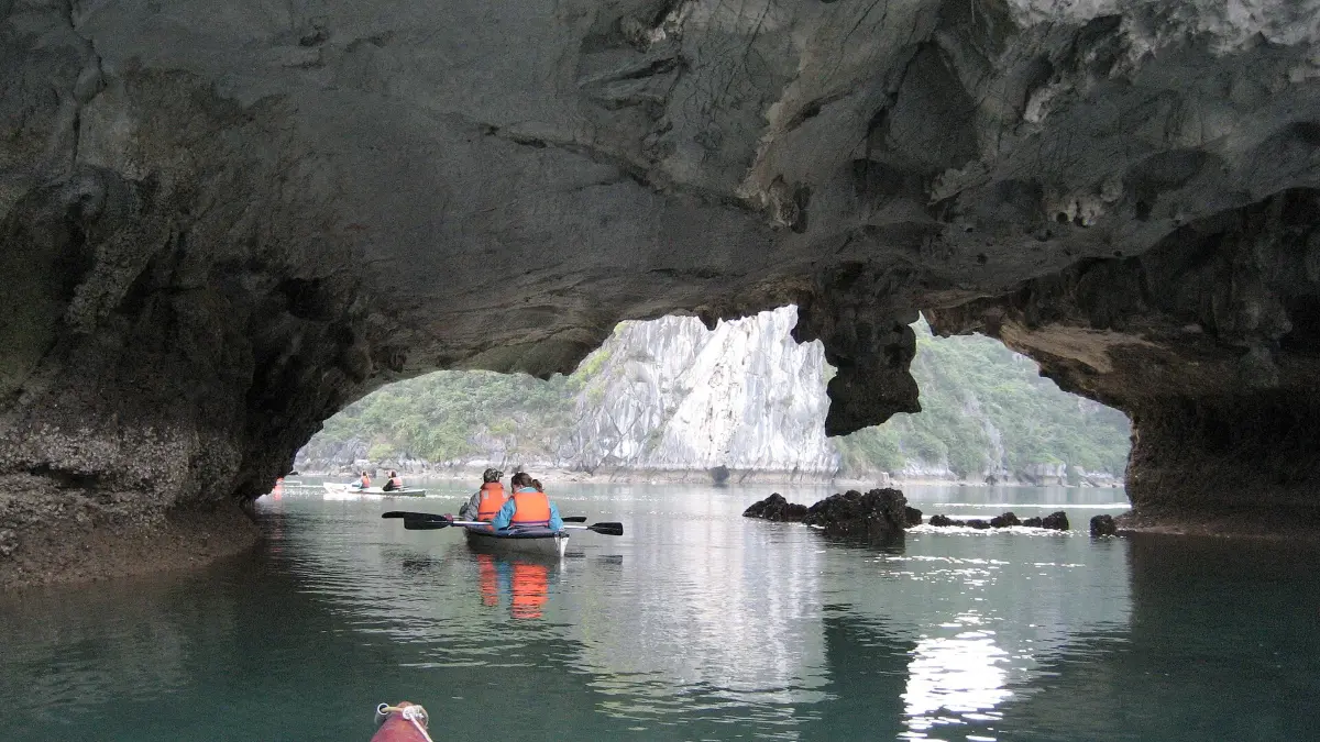 Kayaking in Halong Bay Kayaks paddling among the limestone karsts of Halong Bay