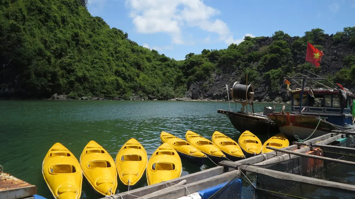 Kayaking near Cat Ba, Lan Ha Bay Kayakers paddling among the karsts near Cat Ba, Lan Ha Bay