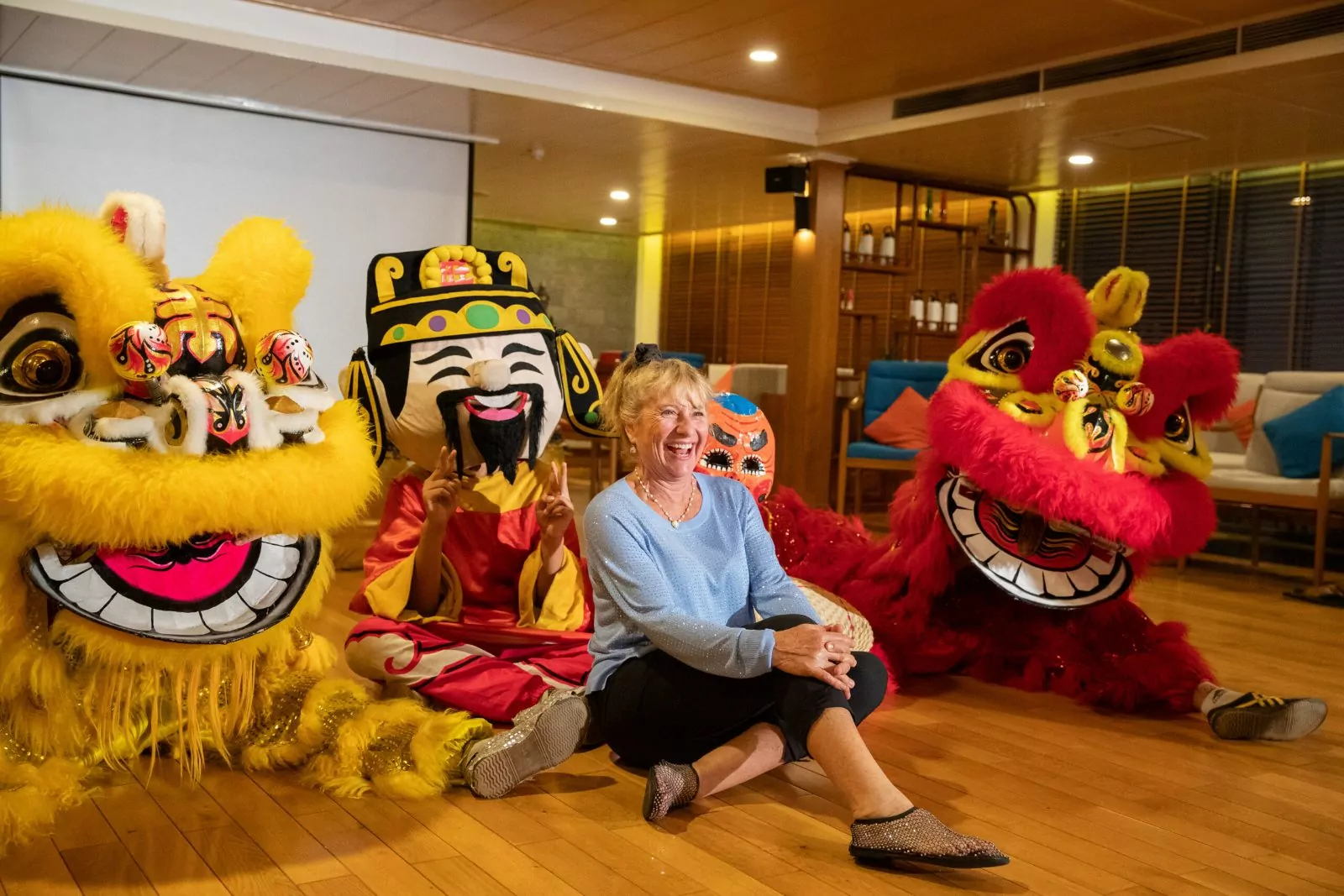 Lion dance performance with guests on board the Victoria Mekong cruise