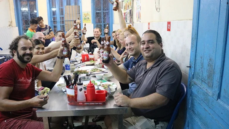 Toasting at a local restaurant in Hanoi