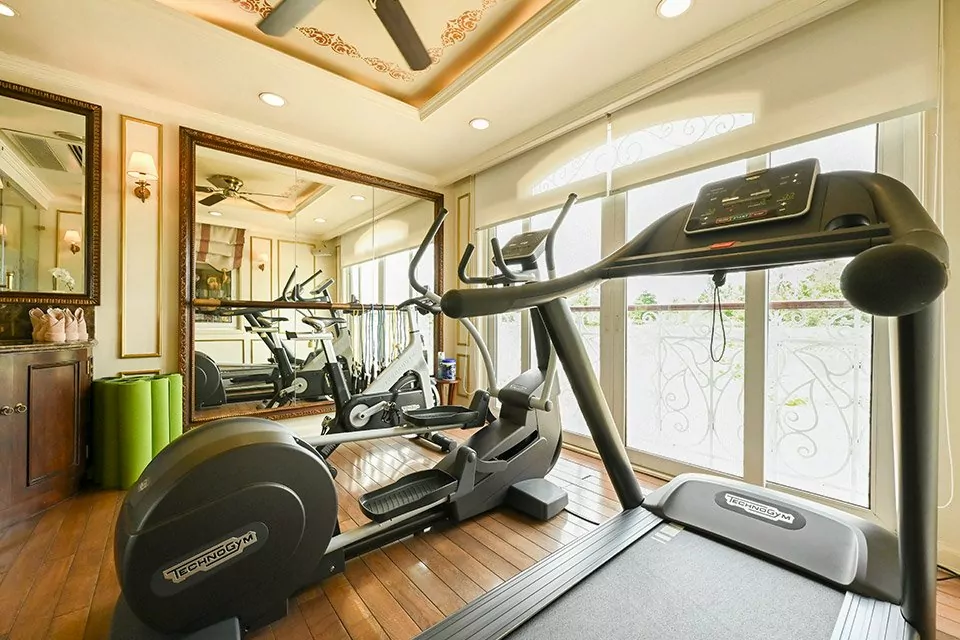 Fitness centre with river-view windows on the Mekong Princess