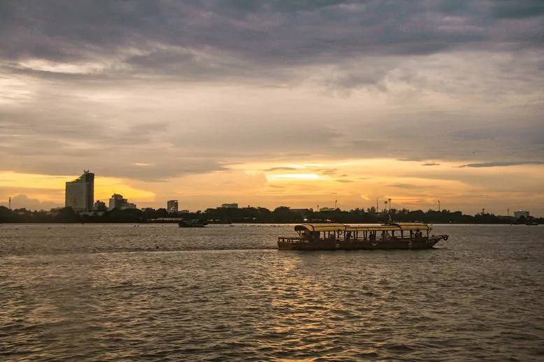 Mystic sampan returning to Can Tho at sunset