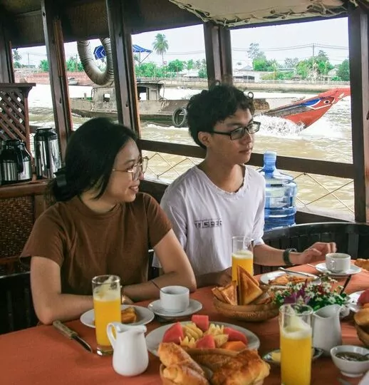Breakfast on board a Mystic sampan on the way to the Cai Rang floating market, Can Tho