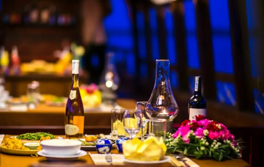 Refined dinner served on board a Mystic sampan