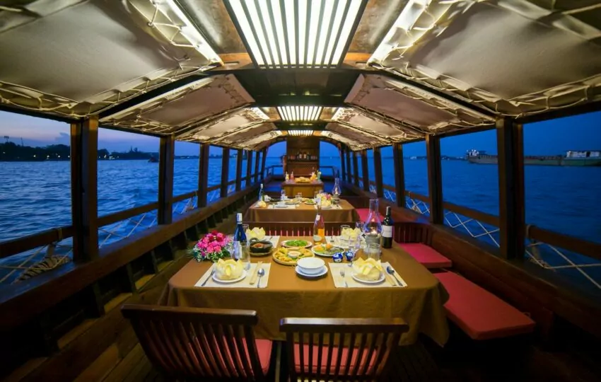 Private dinner table set on a Mystic sampan