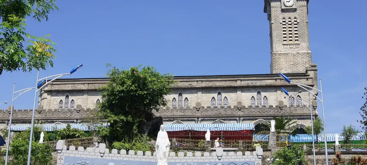 Gothic stone facade of Nha Trang Cathedral on its hill