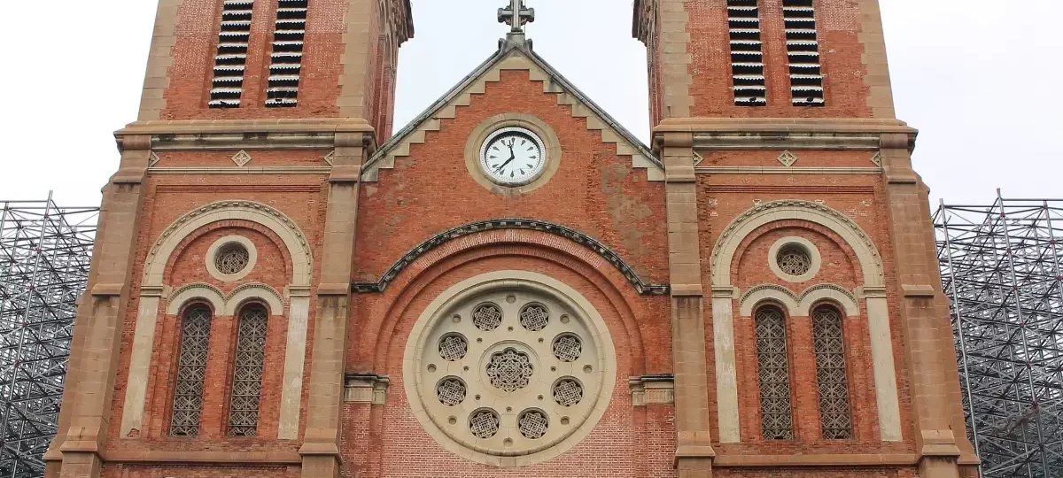 Red-brick twin towers of the Notre-Dame Cathedral Basilica of Saigon