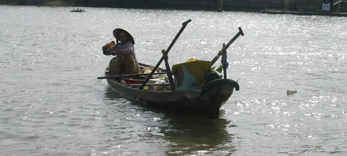 Small sampan boat on a river in Phong Dien, Mekong Delta