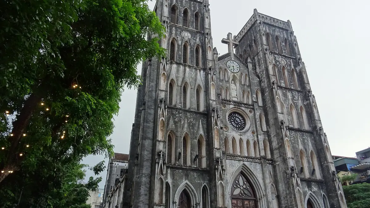 St Joseph's Cathedral Hanoi from Nha Tho Street Grey stone facade of St Joseph's Cathedral Hanoi seen from Nha Tho Street