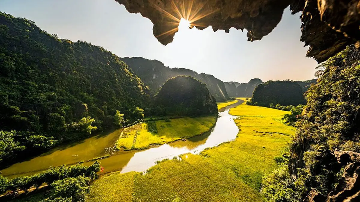 Tam Coc rice fields from a cave – Hanoi Ninh Binh Cuc Phuong group tour