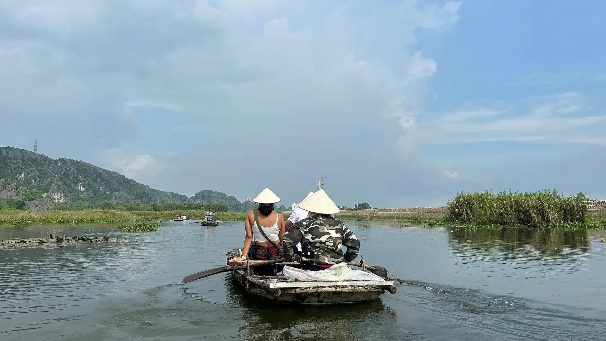 Rowing Boat in Tam Coc, Ninh Binh Rowing boat with visitors on the Ngo Dong River in Tam Coc, Ninh Binh