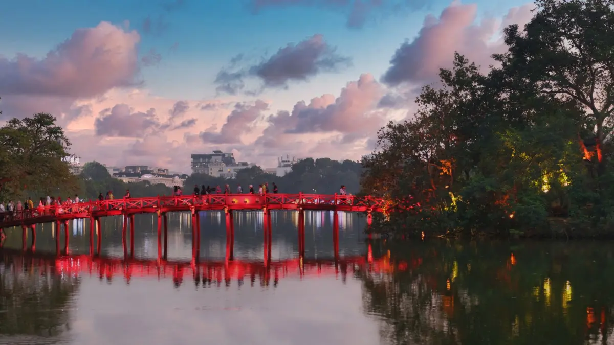 The Huc Bridge at Sunset, Hoan Kiem Lake The red Huc Bridge reflected in Hoan Kiem Lake at sunset, Hanoi