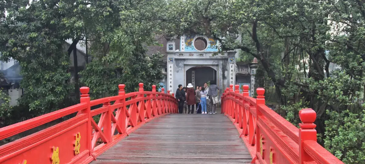 The red Huc Bridge leading to Ngoc Son Temple on Hoan Kiem Lake, Hanoi