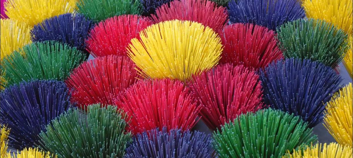 Bundles of colourful incense sticks drying in Hue