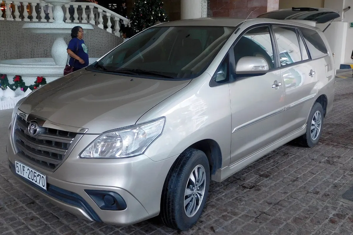 Silver Toyota Innova 7-seat car with a Vietnamese number plate in Ho Chi Minh City