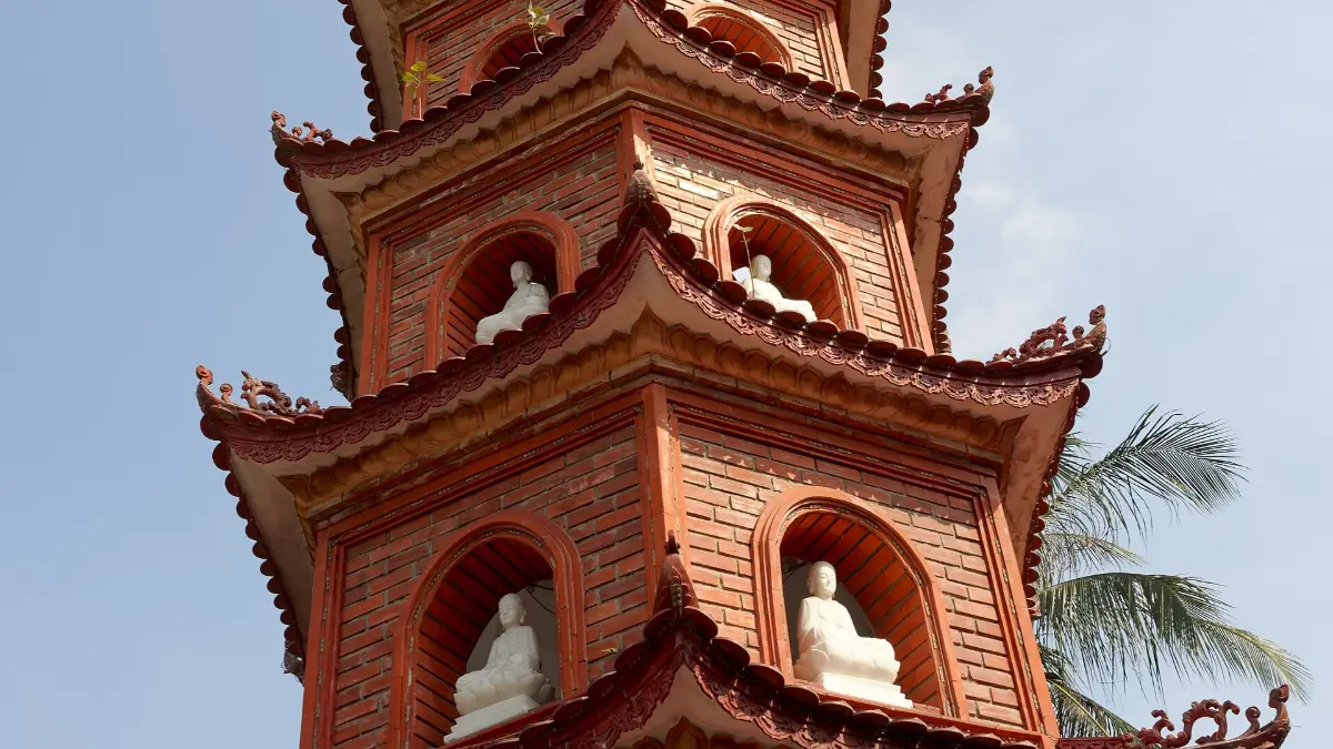 Buddha Niches on the Tran Quoc Pagoda Stupa Close-up of the Tran Quoc Pagoda stupa with white Buddha statues in its arched niches