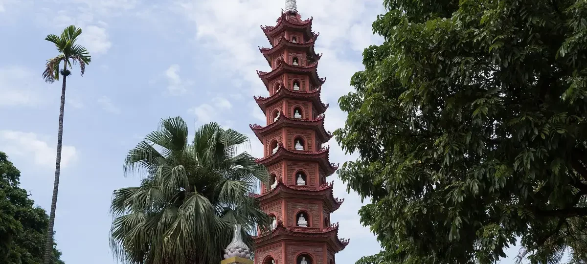 The red 11-storey stupa of Tran Quoc Pagoda on its islet in West Lake, Hanoi