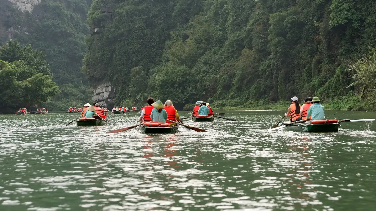 Boats at Trang An, Ninh Binh Rowing boats with visitors on the river at Trang An, Ninh Binh