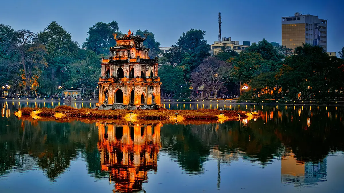 Turtle Tower, Hoan Kiem Lake – Legend of the Returned Sword Turtle Tower lit up at dusk on Hoan Kiem Lake, Hanoi