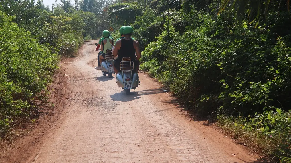 Vespa on a country trail near Saigon