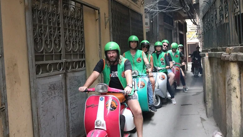 Vespa ride through a Hanoi alley