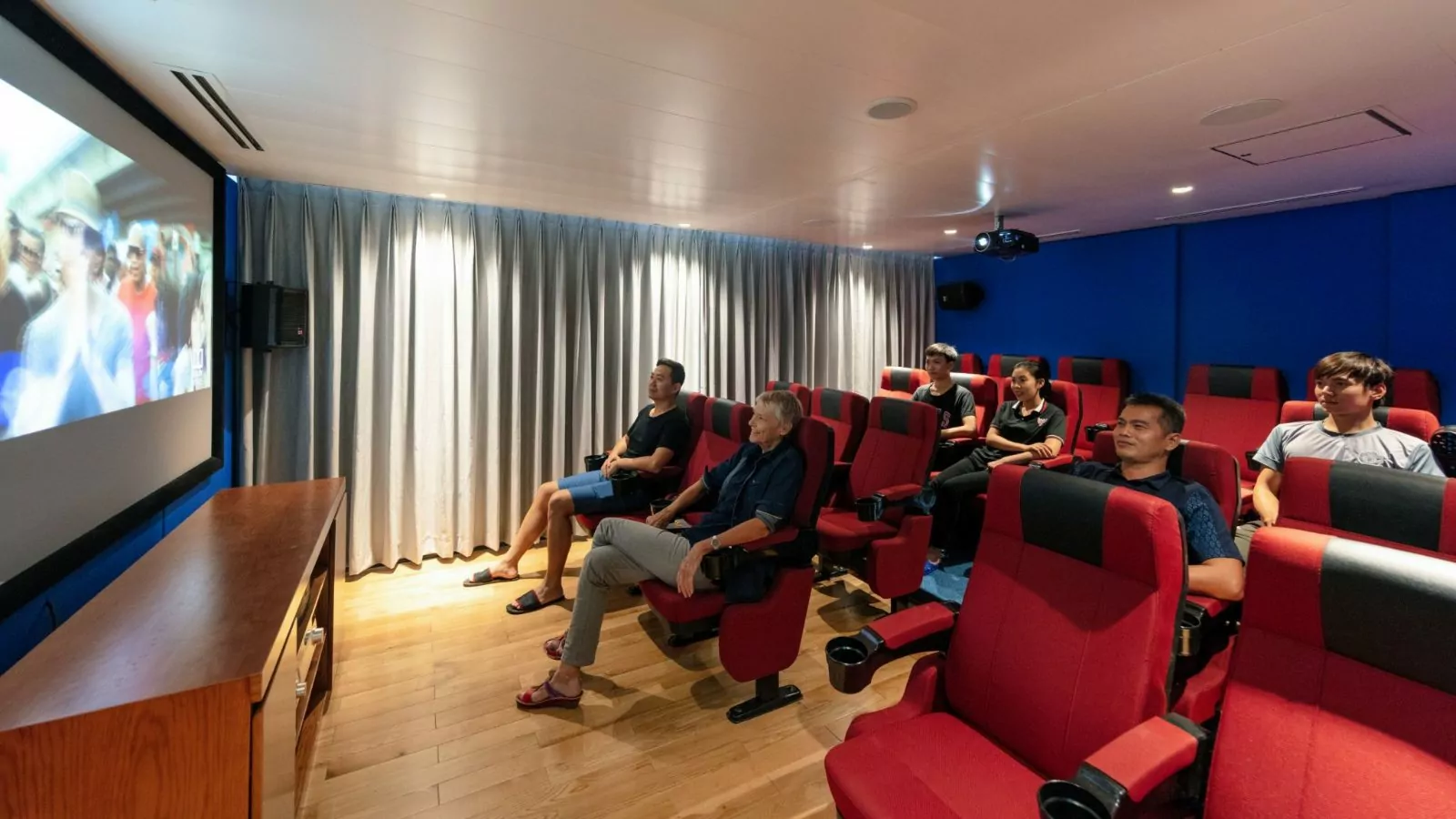 Guests watching a film in the cinema room