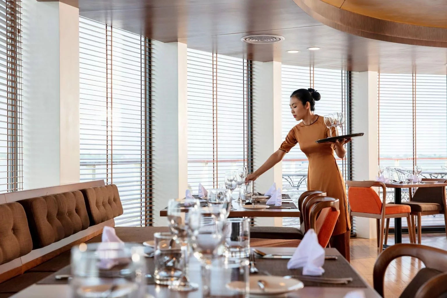Crew member serving guests in the Claypot Restaurant
