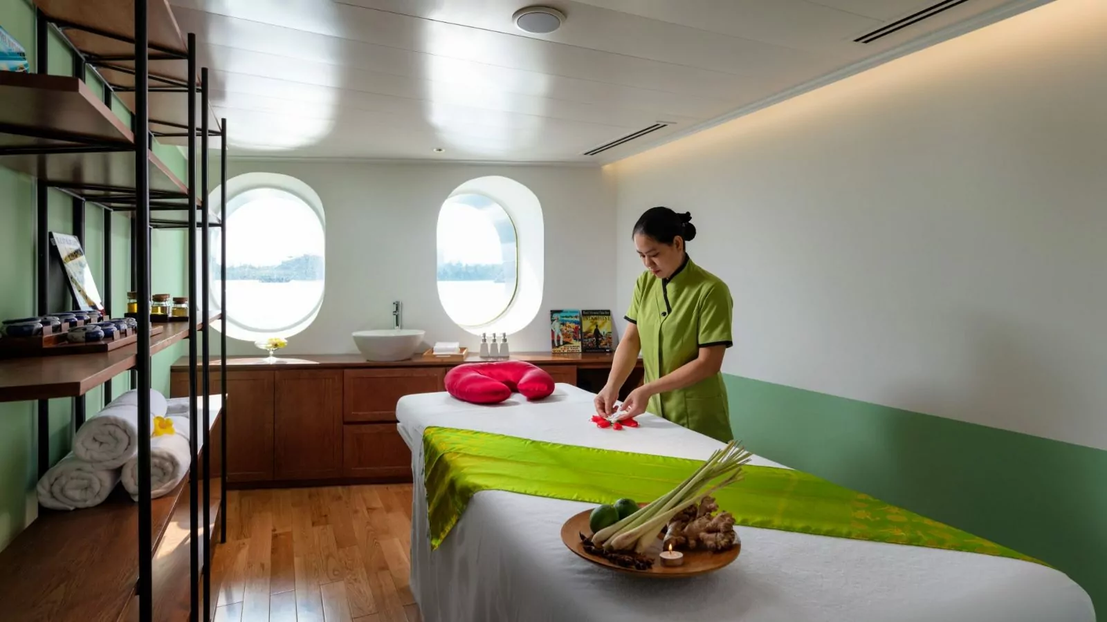 Therapist preparing a treatment room at the Green Lotus Spa