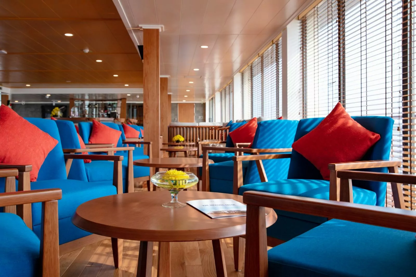 Lounge seating with blue sofas and Mekong River views