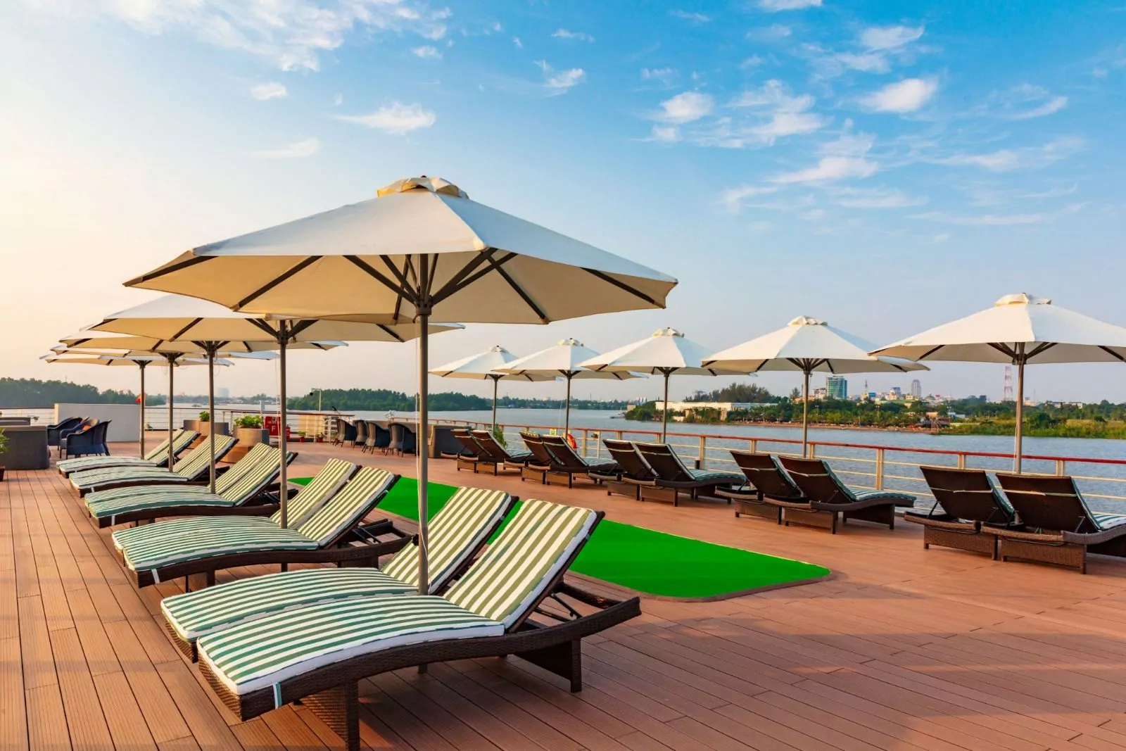 Sun loungers, parasols and mini-golf green on the Victoria Mekong sky deck
